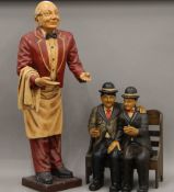 A model of Laurel and Hardy, and a model of a waiter. The latter 93 cm high.