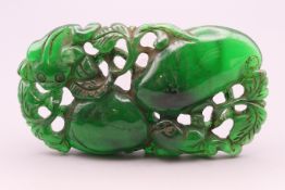 A carved green jade pendant. 8 cm x 4 cm.