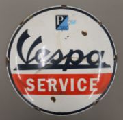 An enamel Vespa sign. 29 cm diameter.