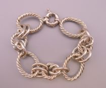 A heavy silver rope design bracelet. 21 cm long. 78.9 grammes.