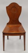 A Victorian shield back hall chair.