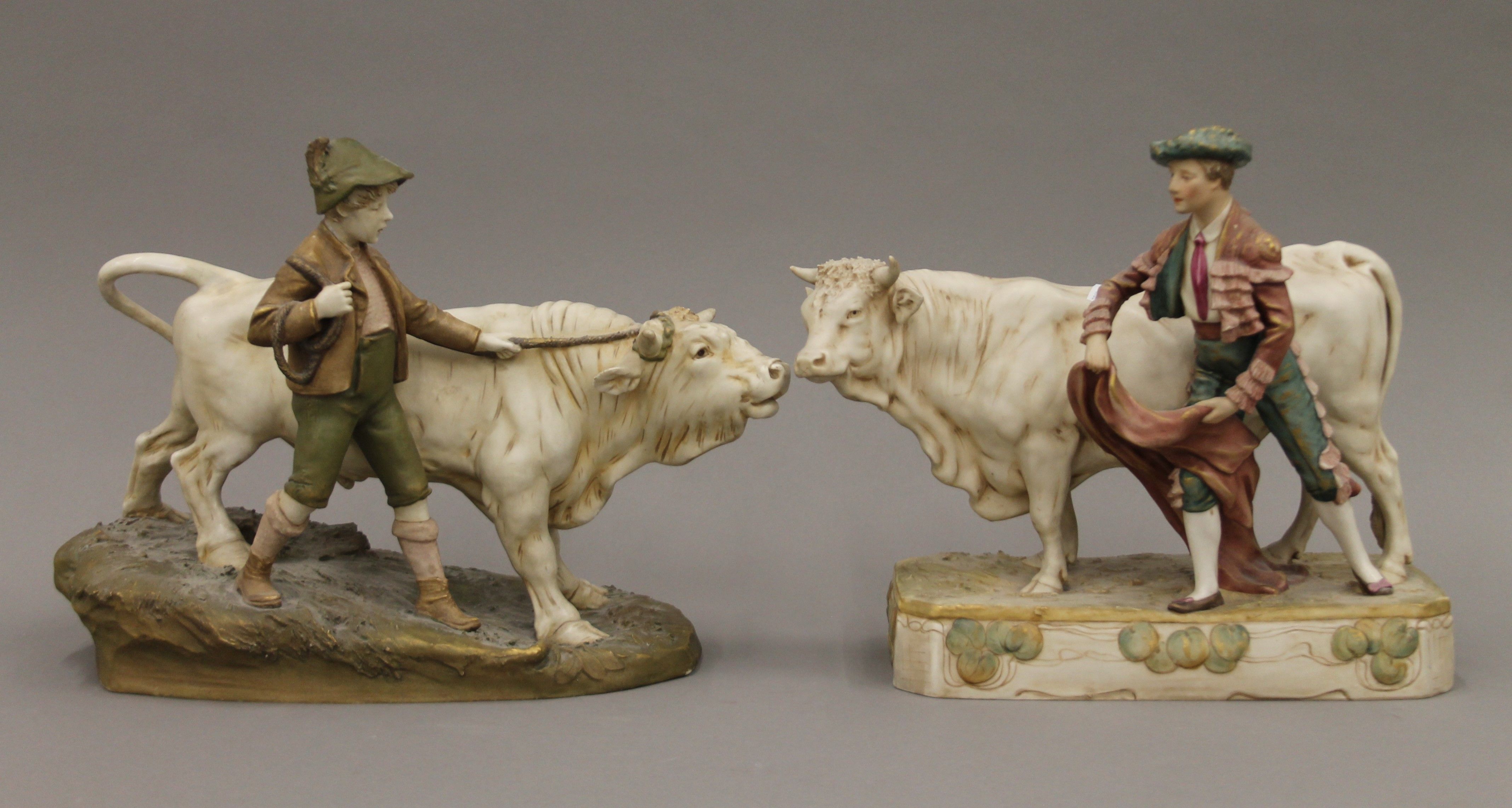 Two Royal Dux porcelain bull groups. Boy with bull 35 x 28 cm, other 30 x 27.5 cm.