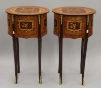 A pair of oval inlaid three drawer side tables. Approximately 37 cm wide.