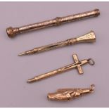 Four propelling pencils, one formed as a cross, another as a clergyman. Largest 8.5 cm long.