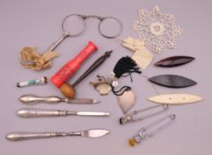 A quantity of miscellaneous items, including lorgnettes, an enamel cigarette holder, etc.