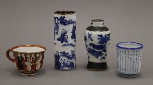 Three various Oriental vases and a cup. The largest 13 cm high.