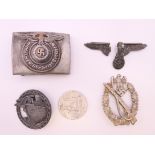A quantity of German military buckles, badges, etc.