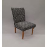 An early 20th century black and white upholstered bedroom chair. 46 cm wide.