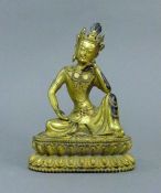 A gilt bronze model of Buddha. 19.5 cm high.
