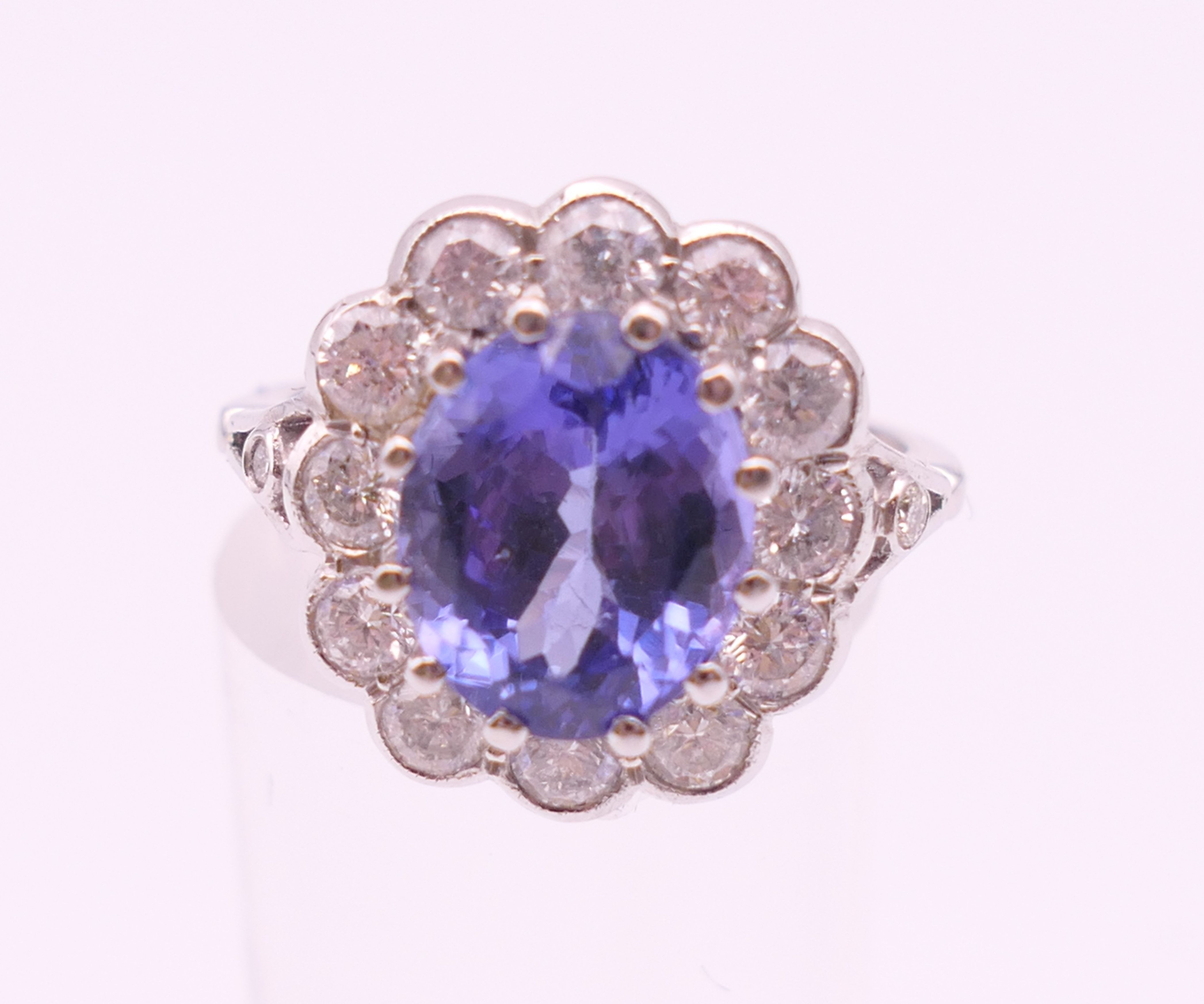 An 18 ct white gold ring with central tanzanite of 2. - Image 2 of 8