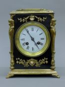 A 19th century brass mounted ebonised mantle clock. 25.5 cm high.
