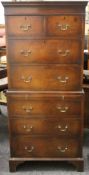 A 20th century mahogany chest on chest with brushing slide. 67 cm wide x 149.5 cm high.