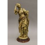 A plaster statue of a classical maiden with gilded patination. 51 cm high.
