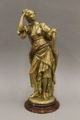 A plaster statue of a classical maiden with gilded patination. 51 cm high.