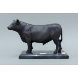 A bronze model of a bull on a marble base. 16 cm high.