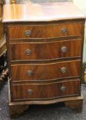 A 20th century Serpentine chest of drawers. 53.5 cm wide.