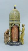A cold painted bronze Arab tower. 31 cm high.