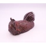 A netsuke in the form of a chicken. 6 cm long.