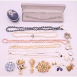 A quantity of various jewellery, to include brooches, necklaces, earrings and a Wedgwood egg, etc.