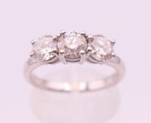 An 18 ct white gold diamond trilogy ring. Total diamond weight approximately 1.2 carats.
