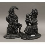 A pair of cast iron Punch and Judy door stops.
