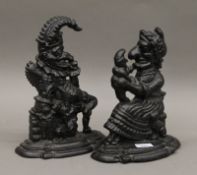 A pair of cast iron Punch and Judy door stops.
