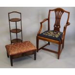 An Edwardian mahogany folding cake stand, an open armchair and a stool.