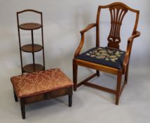 An Edwardian mahogany folding cake stand, an open armchair and a stool.