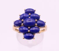 A 9 ct gold and lapis ring. Ring size T.