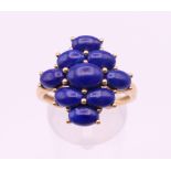A 9 ct gold and lapis ring. Ring size T.