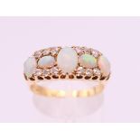 An 18 ct gold diamond and opal ring. Ring size P/Q.