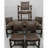 An early 20th century carved oak drawer leaf table and five matching chairs. The former 81.