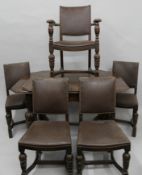 An early 20th century carved oak drawer leaf table and five matching chairs. The former 81.