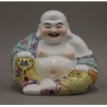 A Chinese porcelain model of Buddha. 21 cm high.