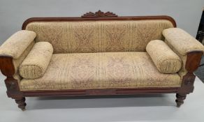 An early 19th century mahogany framed 'Egyptian Revival' settee. Approximately 186 cm long.