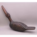 An antique North West Pacific Coast Haida Indian carved wood figure of a duck. 47 cm wide.