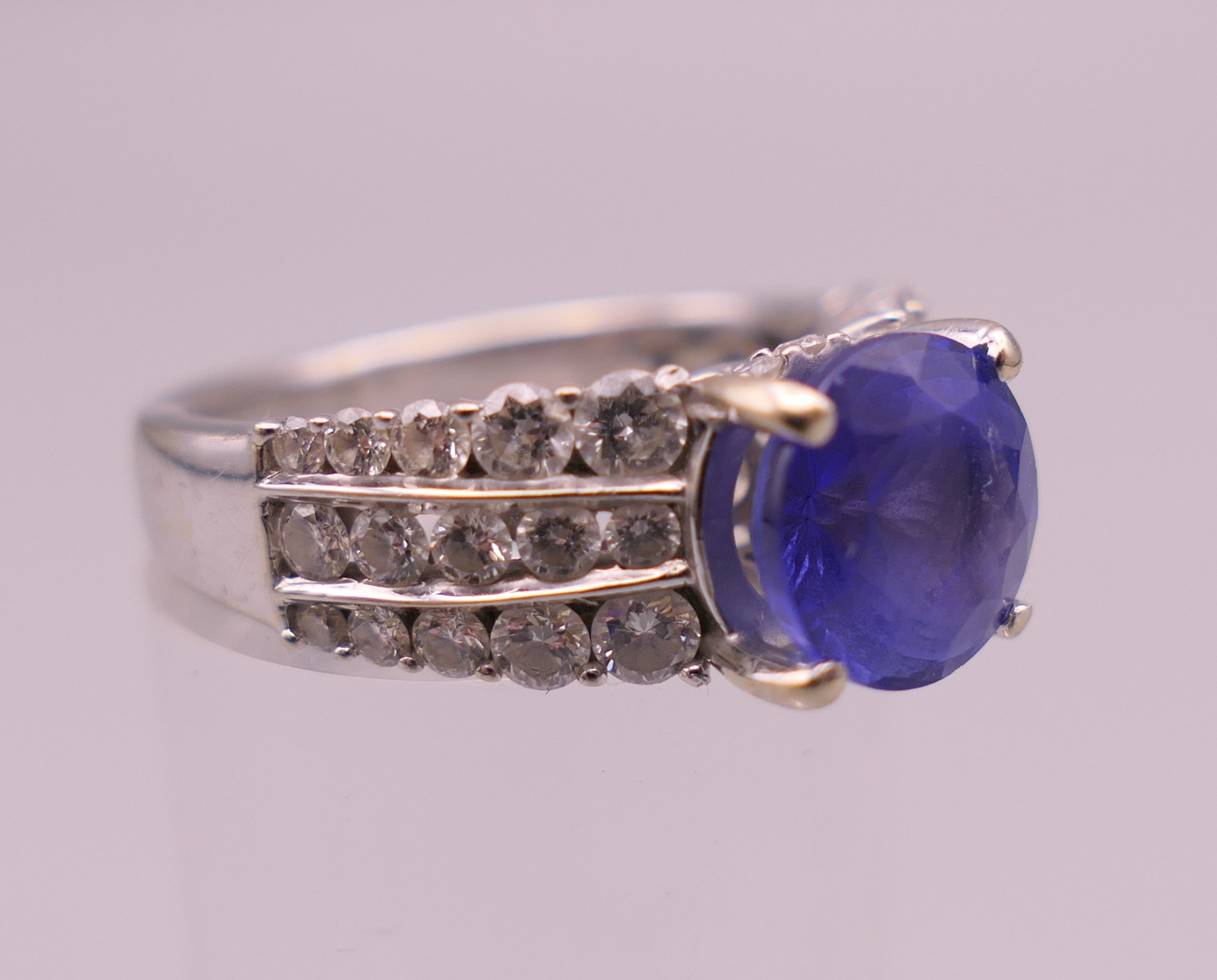 An 18 K white gold diamond and tanzanite ring; - Image 2 of 6