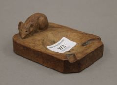 A Mouseman ashtray. 7.5 cm wide.