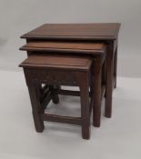 A carved oak nest of three tables. 51 cm wide.
