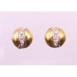 A pair of gold and diamond earrings. 1 cm diameter. 5.3 grammes total weight.