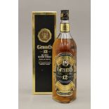 A single bottle of Grant's 12 Year Old Deluxe Scotch Whisky, boxed. 32 cm high.