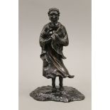 A Japanese Meiji period patinated bronze model of a deity. 22 cm high.