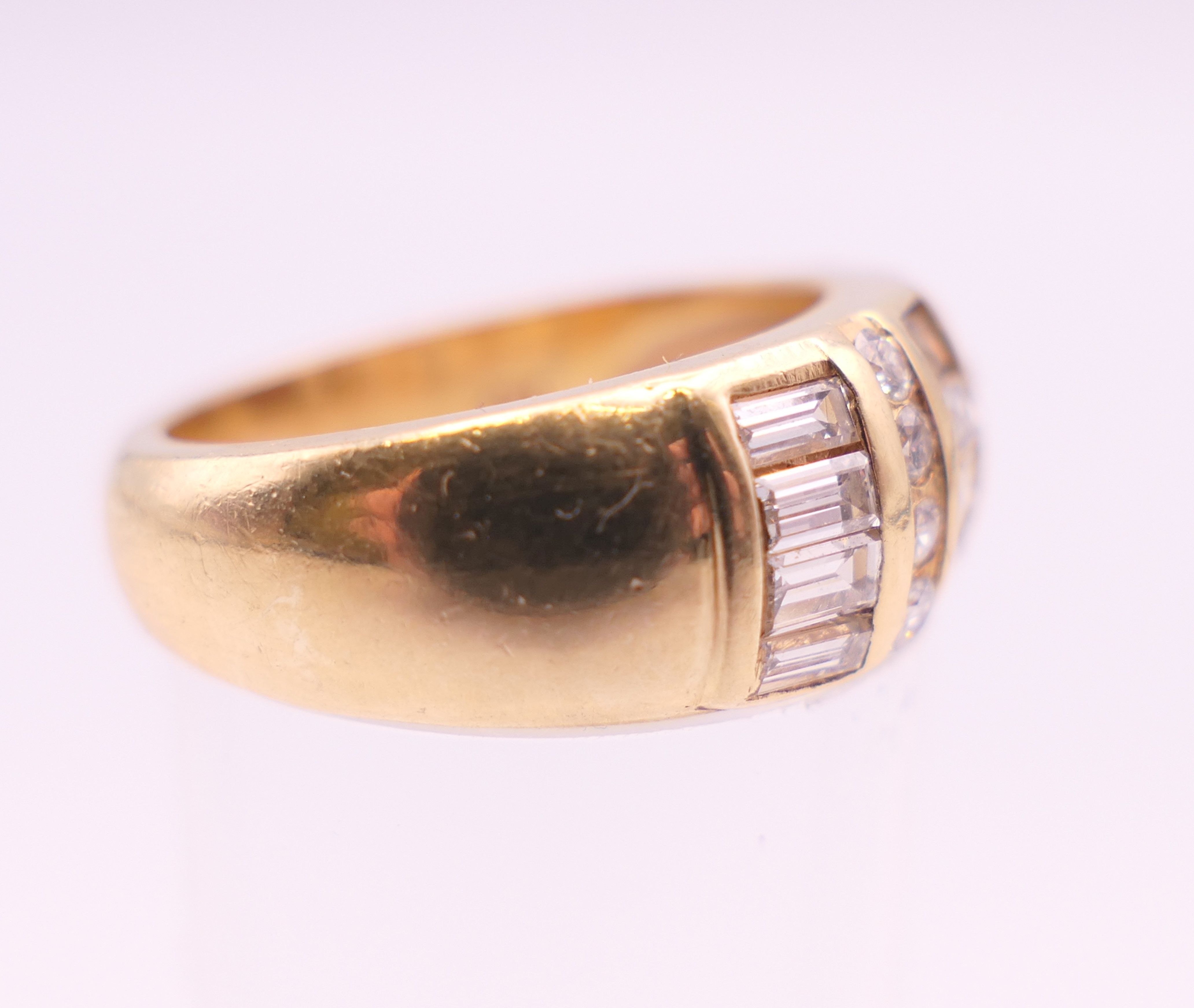 A 14 ct gold ring with twelve baguette and eight brilliant cut diamonds. Ring size L. - Image 2 of 5