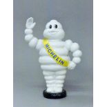 A cast iron Michelin man money box. 23 cm high.