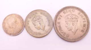 A quantity of Indian silver coins.