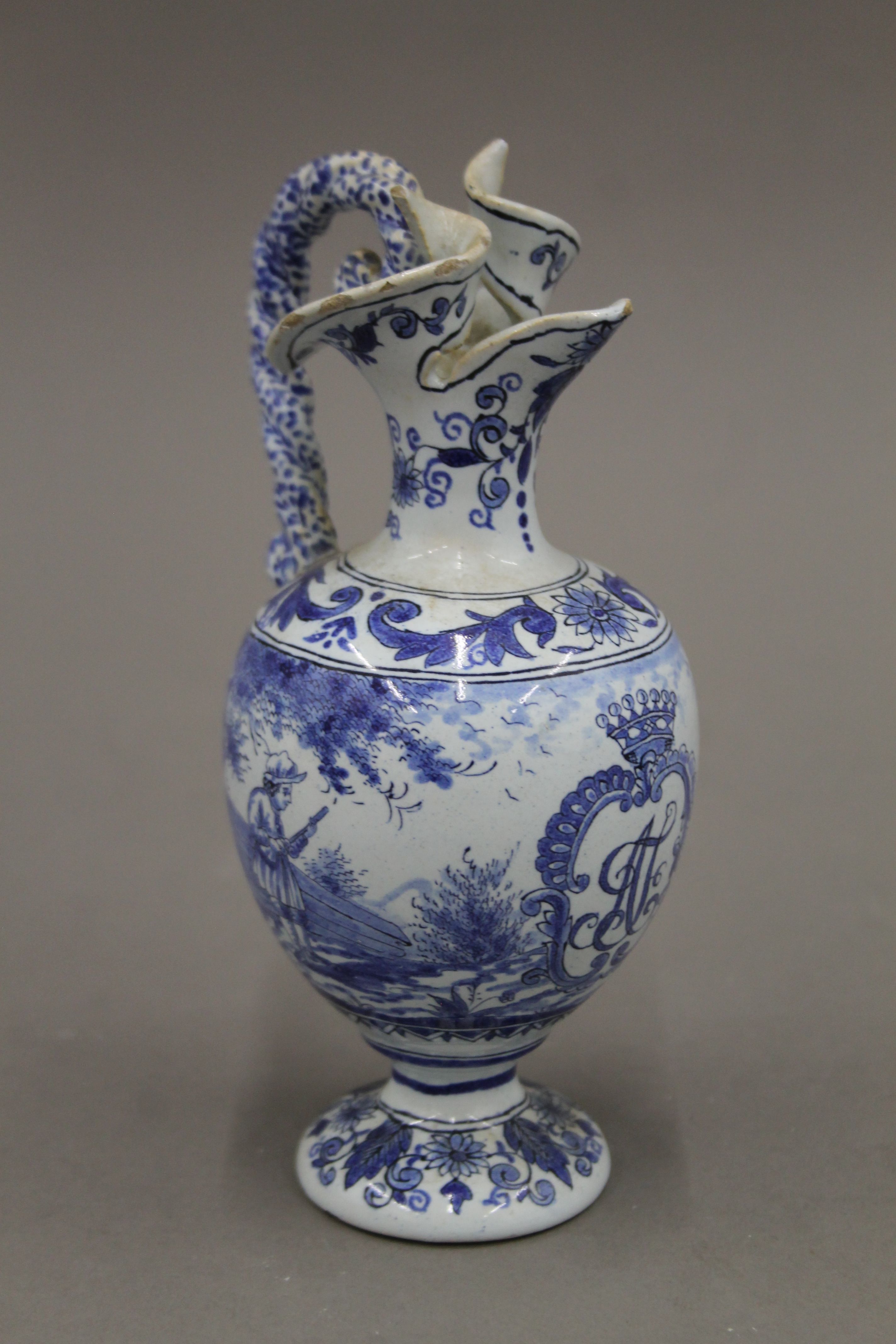 A pair of small 19th century blue and white ewers. 17.5 cm high. - Image 2 of 6