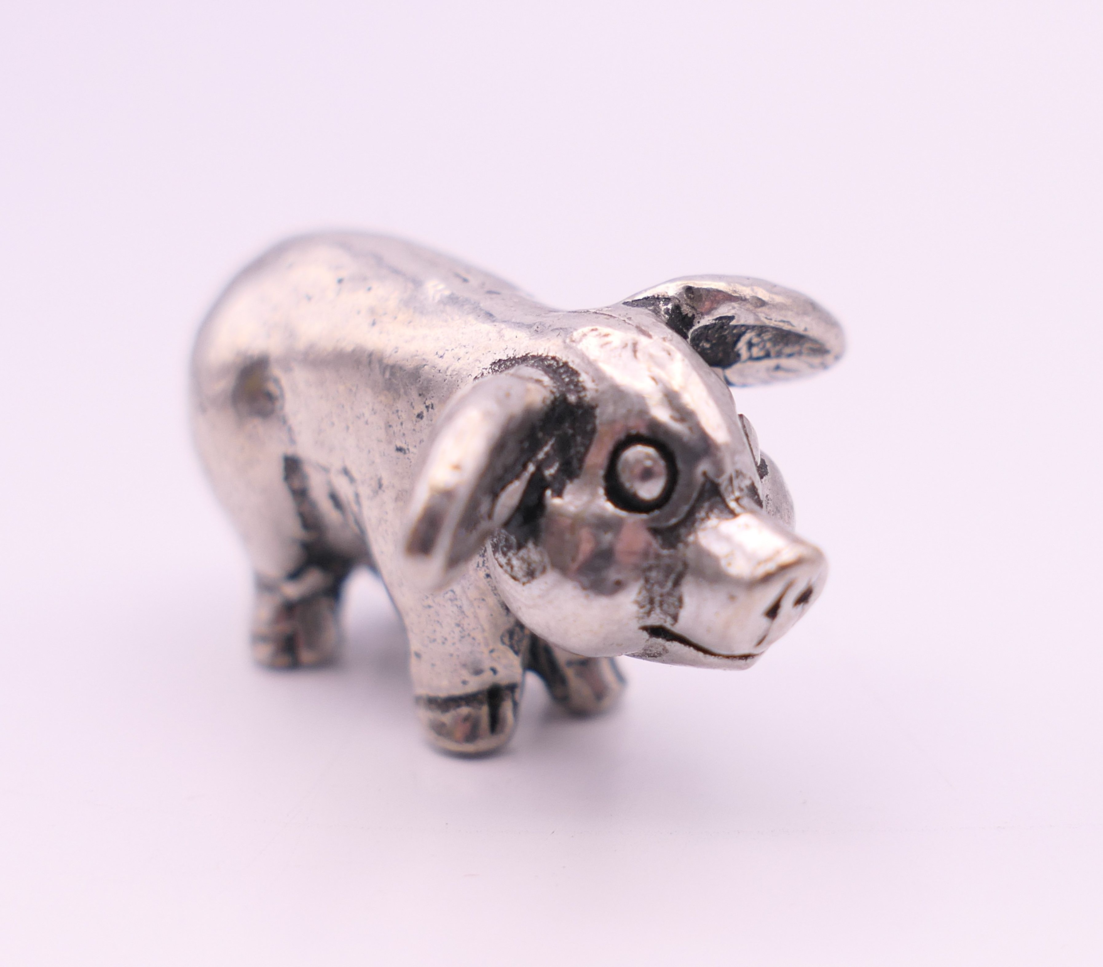 A small white metal model of a pig. 2.5 cm long. - Image 3 of 3