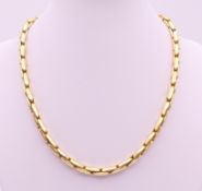 An 18 ct gold necklace. 42 cm long. 33.1 grammes.