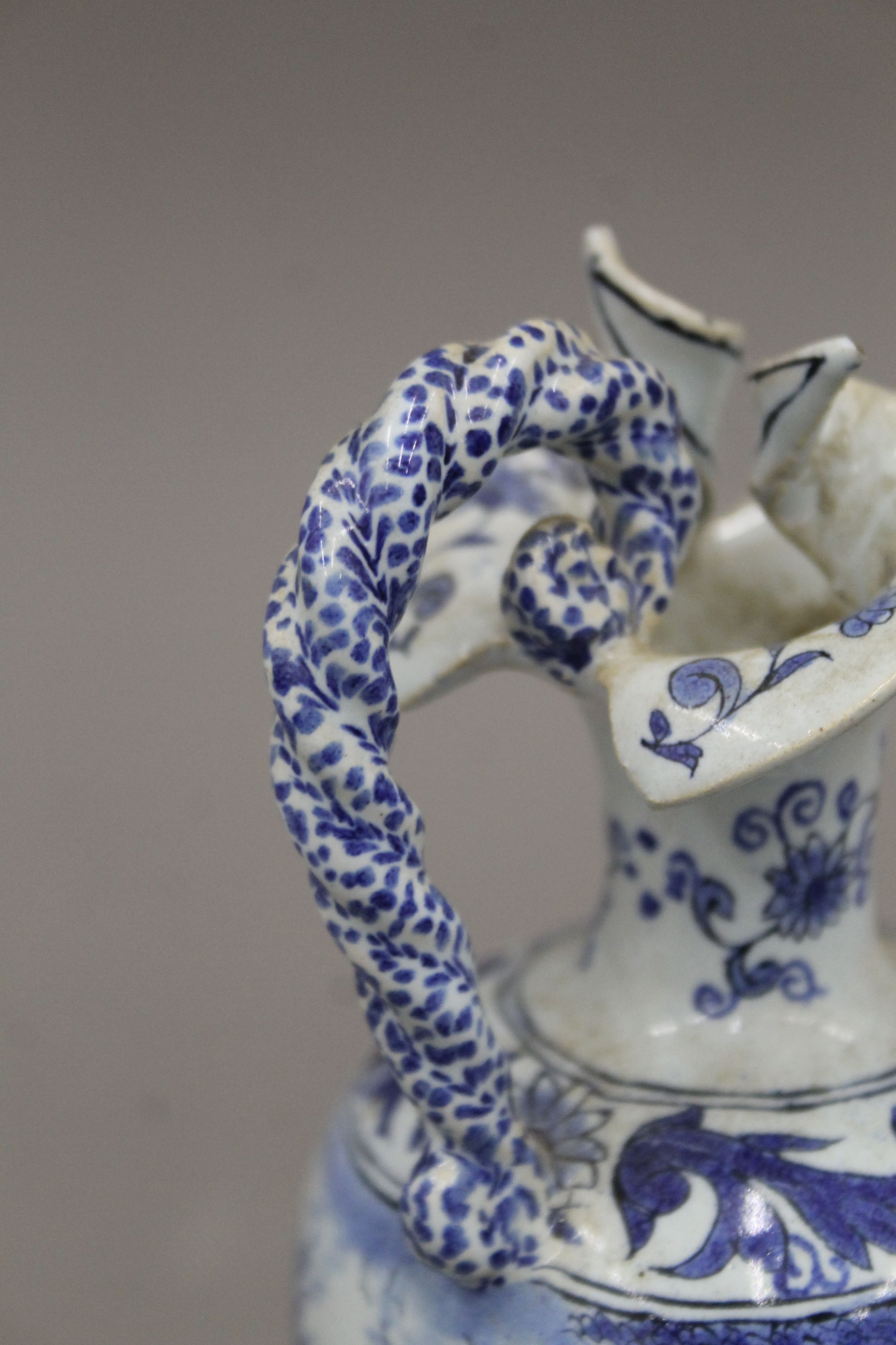 A pair of small 19th century blue and white ewers. 17.5 cm high. - Image 4 of 6