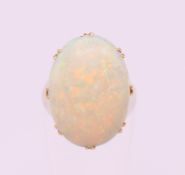 An 18 ct gold opal cabochon ring. Ring size I.